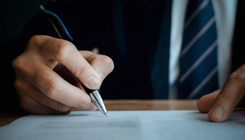 Business proposal - tycoonstory | tycoonstory media Business proposal being written by a professional, with a pen on paper, under the topic'Before You Put Pencil to Paper' related to the pre-planning activities involved in writing a business proposal.