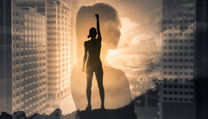 Women Silhouette of an inspiring woman standing confidently against a city skyline, symbolizing strength and empowerment, representing inspiring women in pakistan.