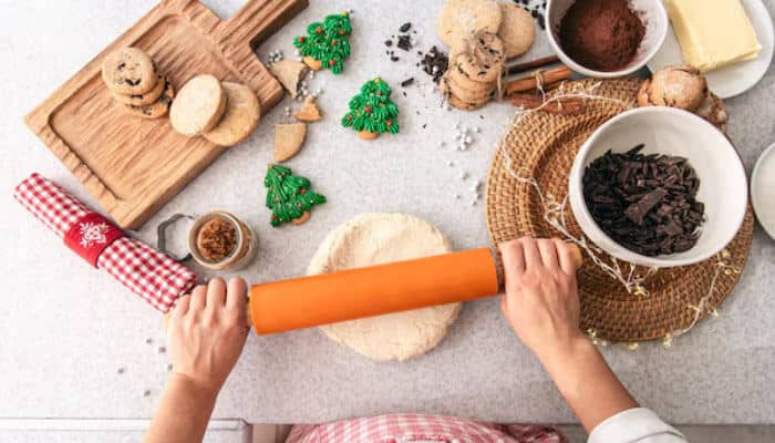 Social enterprise | tycoonstory media Hands preparing baked goods in a kitchen setting, reflecting food production initiatives by a social enterprise.