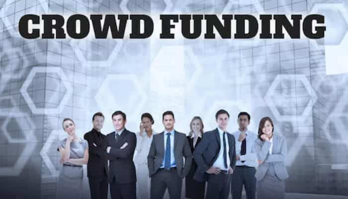 Social crowdfunding | tycoonstory media Business professionals standing under a crowdfunding banner, showcasing community funding strategies for a social enterprise.