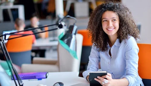 Female entrepreneurs Female entrepreneurs working confidently in a modern office environment using digital tools.
