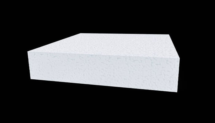 Mit researchers White rectangular foam-like material block displayed on a black background, representing lightweight material studies by researchers.