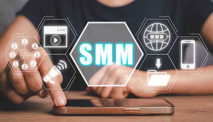 Construction businesses Person using a smartphone with smm social media icons displayed, representing digital marketing tools for construction businesses.