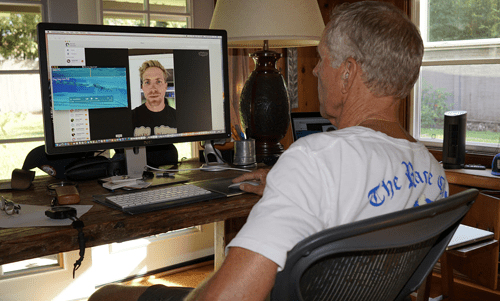 Alternative start-up ideas Older man video conferencing on a desktop computer while working from a home office.
