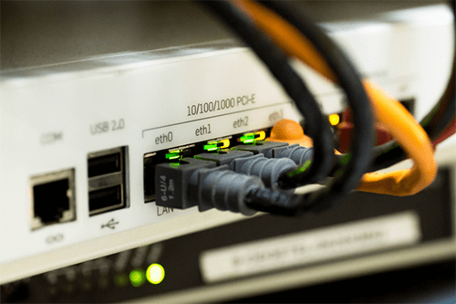 Vpn connection fastest- tycoonstory | tycoonstory media Router with network cables connected, indicating a stable internet connection with vpn for secure data transmission.
