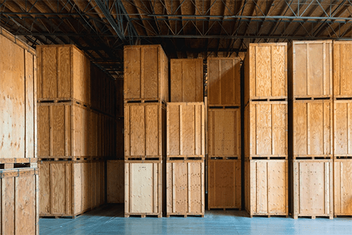 Wooden crates Rows of stacked wooden crates in a warehouse, ready for storage or shipping, showcasing organized packaging solutions.