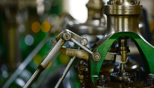 Machine movements and functions - tycoonstory | tycoonstory media Close-up of machinery components in motion, illustrating the importance of guarding mechanisms to ensure safety and efficiency in mechanical systems and operations.