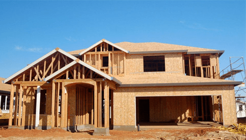 Building a house - tycoonstory | tycoonstory media A house under construction, showcasing a framed structure with the keyword build or not to build in focus.