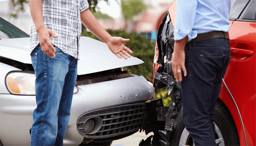 Defense - tycoonstory | tycoonstory media Two drivers discussing damage after a car accident involving front-end collision between two cars.