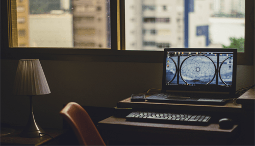 Graphic designer A home office setup with a laptop, ideal for remote work and home-based business ideas.