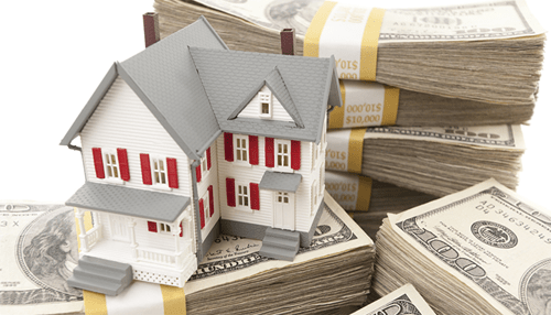 Home improvement loans - tycoonstory | tycoonstory media A miniature house placed on stacks of money, symbolizing the cost of adding a room to a house.