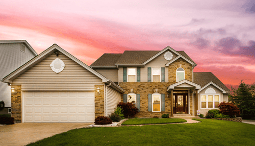 Difference between lenders and brokers A beautifully lit suburban house at sunset, representing homeownership and mortgage options for buyers.