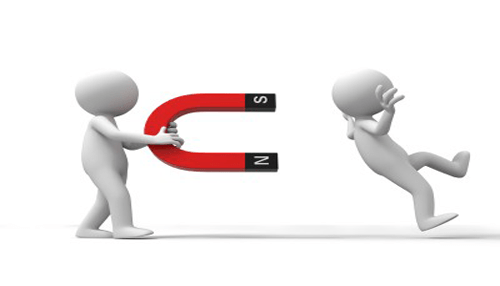 Food business Food business employee retention concept showing a magnet pulling a figure toward another, symbolizing strategies to attract and retain staff.