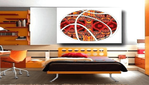 Bachelor pad art - tycoonstory | tycoonstory media Vibrant bedroom featuring orange furniture and sports-themed artwork, ideal for designing a bachelor pad.