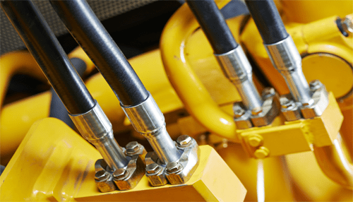 Hoses - tycoonstory | tycoonstory media Close-up of hydraulic hoses and fittings: the critical components of hydraulic systems that ensure power transfer in farming equipment.