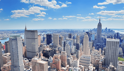 Deciding on the safest spot for your business Aerial view of a major city skyline filled with corporate office buildings, representing a thriving business environment.