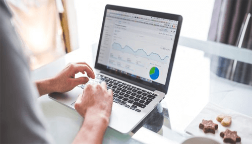 Conflicts - tycoonstory | tycoonstory media Professional working on a laptop analyzing website metrics and reports using advanced website analysis tools.