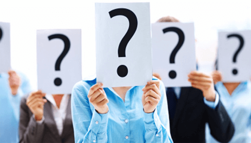 Know thy audience - tycoonstory | tycoonstory media Group of people holding up signs with question marks, symbolizing uncertainty or the unknown in crowdfunding ventures.