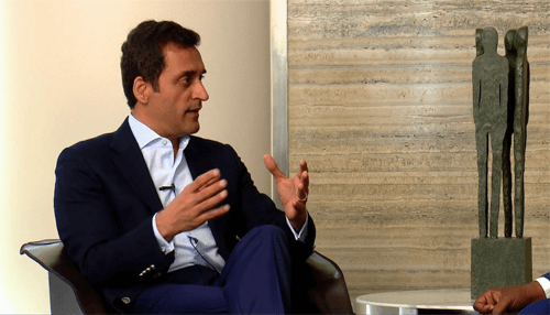 Young business tycoons Vikas oberoi in discussion setting, real estate entrepreneur and corporate executive.