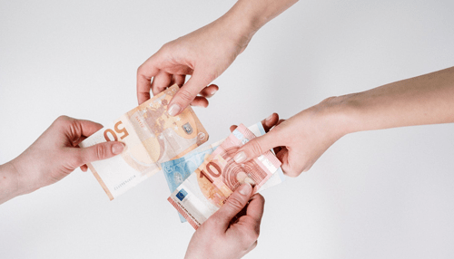 Hands exchanging euro banknotes, symbolizing cash flow and financial transactions Why is cash conversion cycle is important for your business