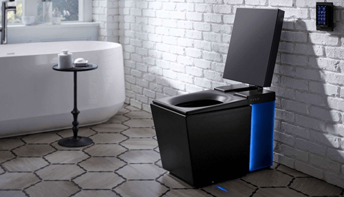 Advantages of using smart toilets - tycoonstory | tycoonstory media Modern smart toilets design featuring a sleek black automated toilet with led lighting in a contemporary bathroom setting.