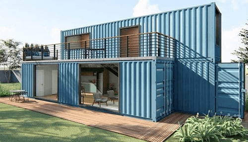 Cargo containers camper A modern two-story home constructed from blue shipping containers, featuring open living spaces, large windows, and an outdoor deck in a landscaped yard.