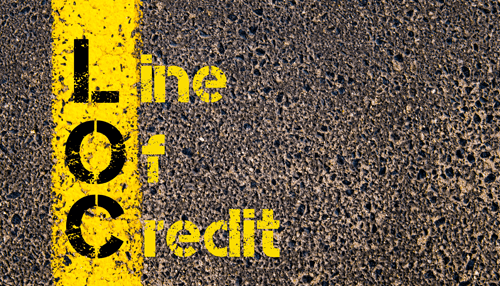 Alternative business financing Close-up of a road with a yellow line showing'Line of Credit', symbolizing alternative business financing options for businesses.