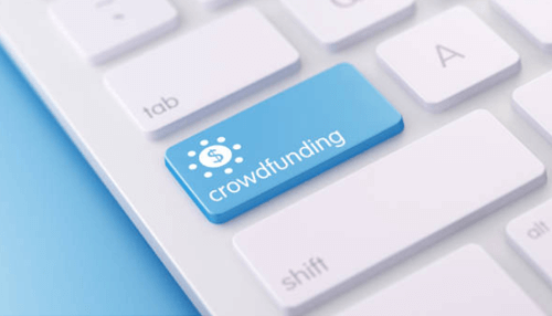 Crowdfunding Close-up of a crowdfunding key on a keyboard, highlighting the use of crowdfunding as an alternative business financing option.