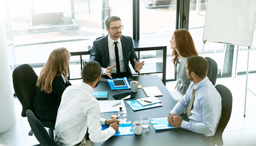 Startup Startup vs. Small business illustrated through a professional team meeting where leaders discuss strategy, growth plans, and operational differences.