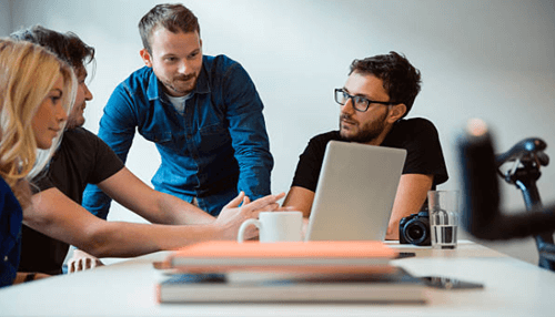 Consultant services A group of professionals collaborating and discussing ideas, focusing on startup consultant services for feedback