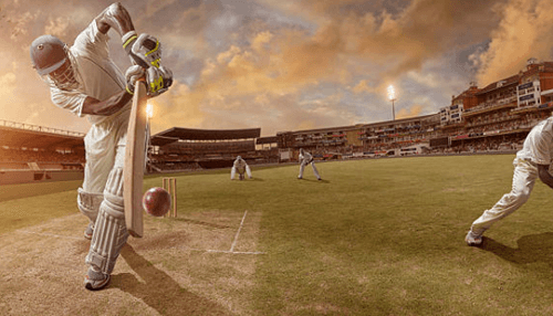 Cricket betting in india -tycoonstory | tycoonstory media An action-packed cricket match under a sunset sky, capturing a batsman mid-swing as platforms for online betting provide fans with dynamic ways to engage with every wicket and run.