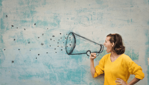 Entrepreneurial marketing A person wearing a yellow sweater shouting into a drawn megaphone, symbolizing the power of entrepreneurial marketing strategies to amplify messages and reach audiences effectively.