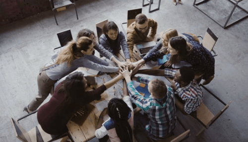 Equity crowdfunding - tycoonstory | tycoonstory media A diverse team collaborating and strategizing together, symbolizing the teamwork and unity needed in equity finance for successful investments.