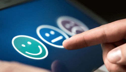Make comments for review - tycoonstory | tycoonstory media User tapping a smiley face rating system on a touchscreen as part of a pdf file feedback or survey process.