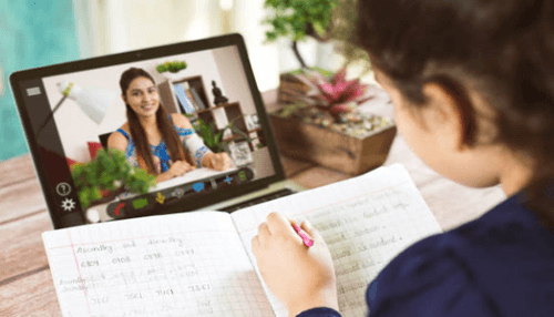 Teach students online-tycoonstory | tycoonstory media Digital nomad attending an online class or video meeting while working remotely from home