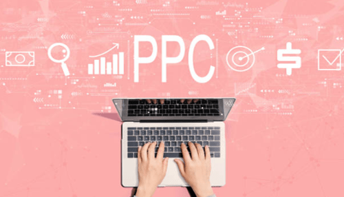 Ppc report types-tycoonstory | tycoonstory media Person working on a laptop with digital icons representing ppc (pay-per-click) advertising, including search, analytics, and financial symbols.