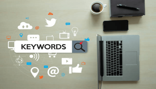 Keywords-tycoonstory | tycoonstory media Laptop and digital icons illustrating keyword research for pay per click advertising.