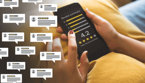 Branding-tycoonstory | tycoonstory media Entrepreneurs reviewing online customer ratings and feedback on a smartphone to improve business reputation.