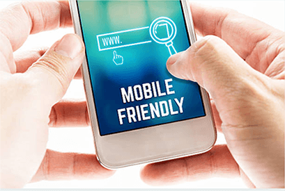 Optimize website for mobile devices-tycoonstory | tycoonstory media Close-up of hands holding a smartphone displaying a search bar with a magnifying glass icon and the text "mobile friendly," emphasizing the importance of a great customers' Digital Experience on mobile devices.