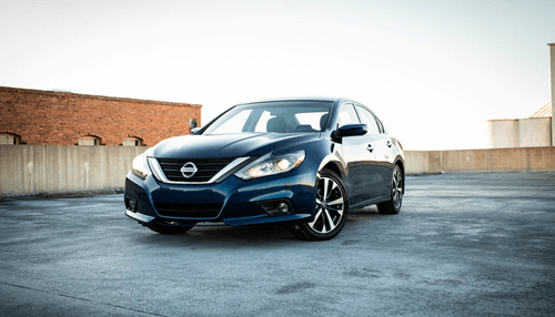 Buying a business vehicle - tycoonstory | tycoonstory media A sleek blue nissan altima parked on a rooftop, representing a modern choice for investing in a vehicle.