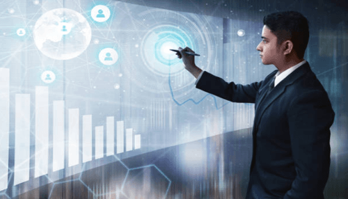 Setting business goals A business professional interacting with a futuristic digital interface displaying charts, global connections, and analytics data.