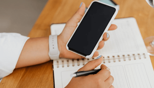 Cross number puzzle Using a mobile app to play a cross number puzzle while taking notes.