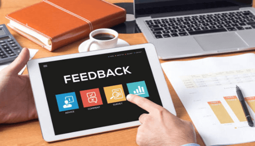 Importance of feedback-tycoonstory | tycoonstory media Tablet screen displaying the word'FEEDBACK' with icons for advice, comments, and surveys, symbolizing the process of collecting employee feedback