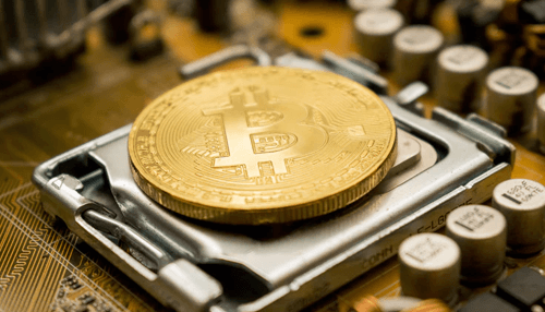 Transactions in local banks - tycoonstory | tycoonstory media Bitcoin coin placed on a computer motherboard, representing the connection between bitcoin and technology in digital currencies and blockchain.