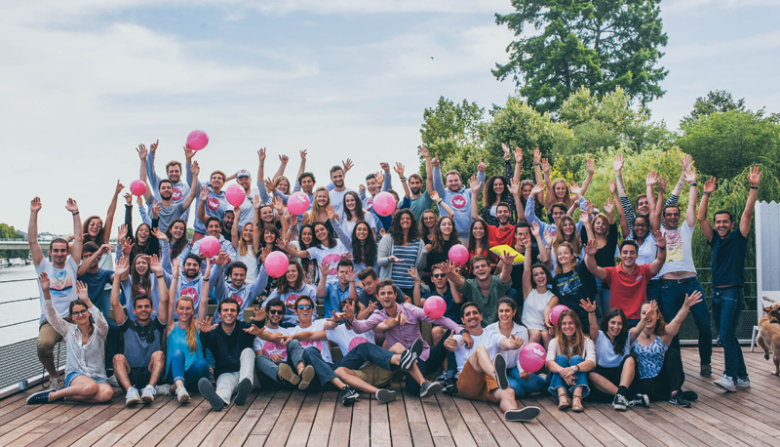 Click&boat Large group of smiling team members celebrating together outdoors, showcasing company culture and community at click&boat.