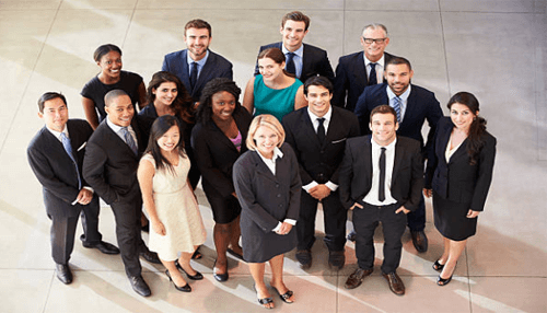 Entrepreneur Entrepreneurs standing together as a diverse professional team in business attire, representing collaboration, expertise, and hiring the right people to strengthen entrepreneurial weaknesses.