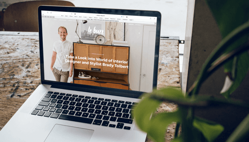 Startup Open laptop displaying a designer’s website, representing startup branding and digital presence development.