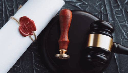 Legal pronouncement of death A gavel and a legal document symbolizing the legal proceedings that follow when a loved one dies, ensuring justice and compensation.