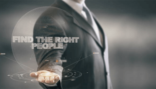 Find the right people Recruiting: a professional in a suit holding his hand out with a holographic display of the words find the right people, symbolizing recruitment and talent acquisition.