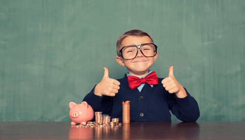 Money saving tips for small business A young boy giving thumbs up beside a piggy bank and stacked coins, representing effective cost-cutting and saving strategies